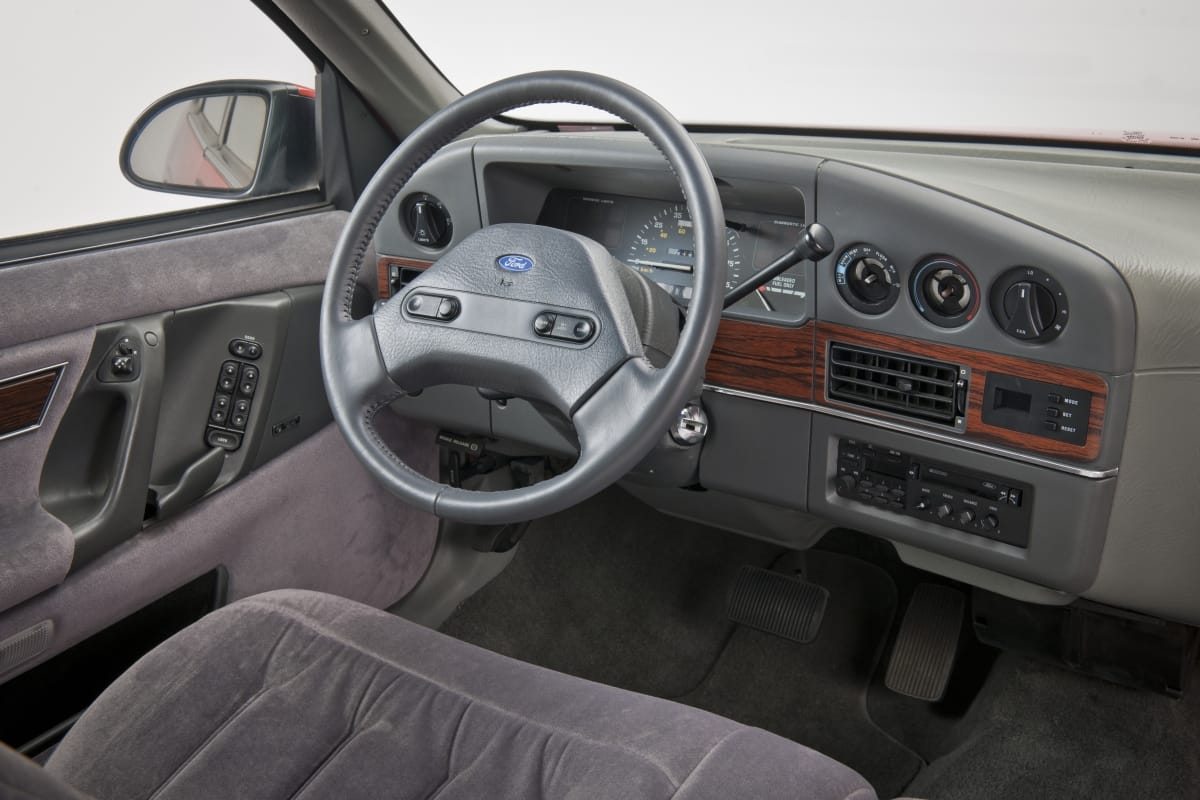 Image taken from driver's seat of car steering wheel and instrument panel
