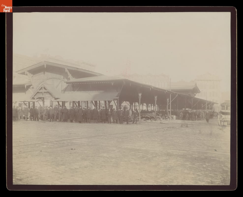 Vegetable Building at Detroit's Central Market, circa 1885 Large, low open building with many people gathered inside and near it