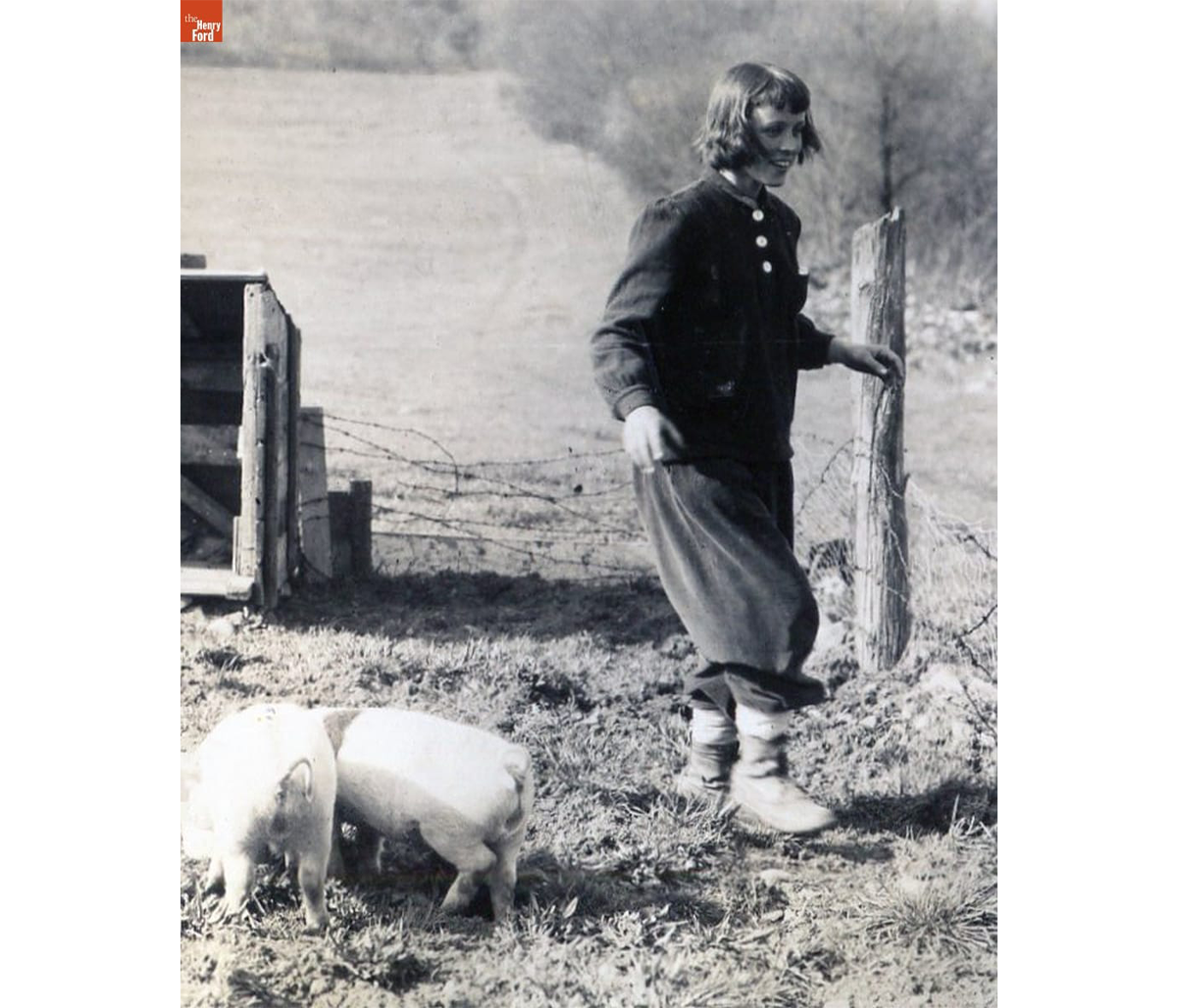 Lois Kelley with the first piglets, 1948 / THF720528