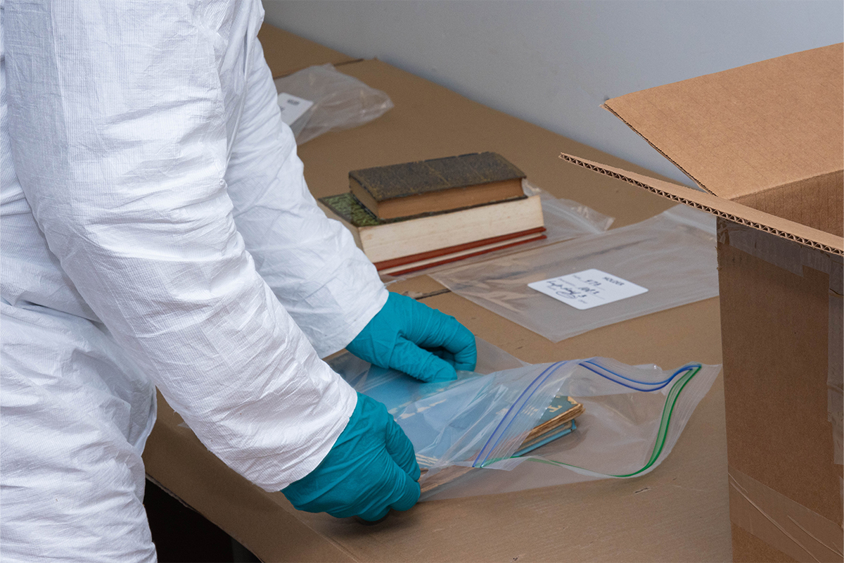 Staff at The Henry Ford organize archive and library materials in preparation for work with an abatement contractor.