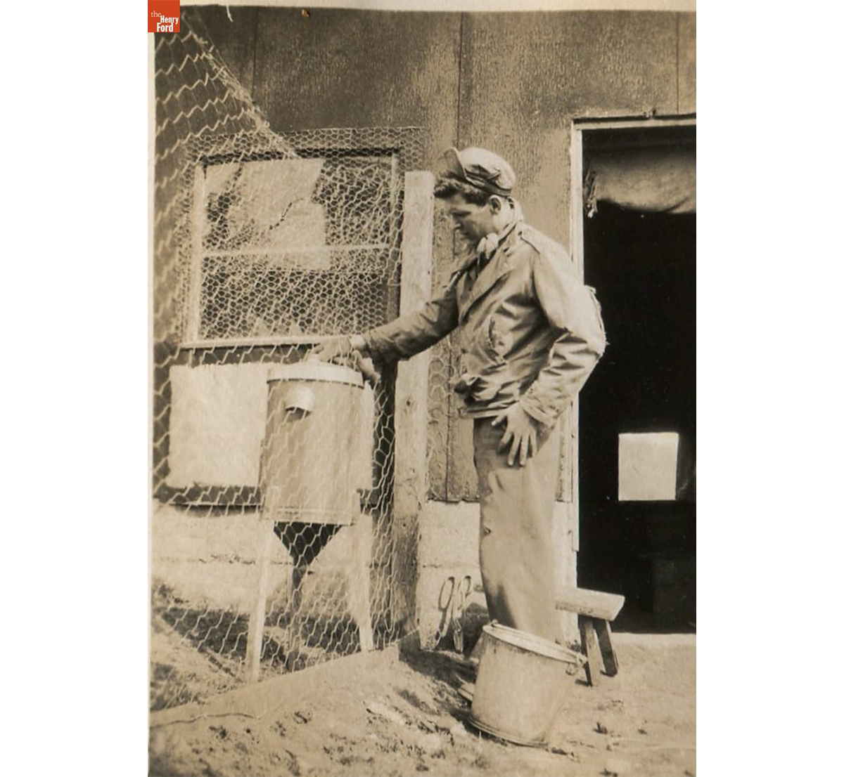 New chicken coop at the Kelley farm with feeder (likely a repurposed cream separator), 1948 / THF720526
