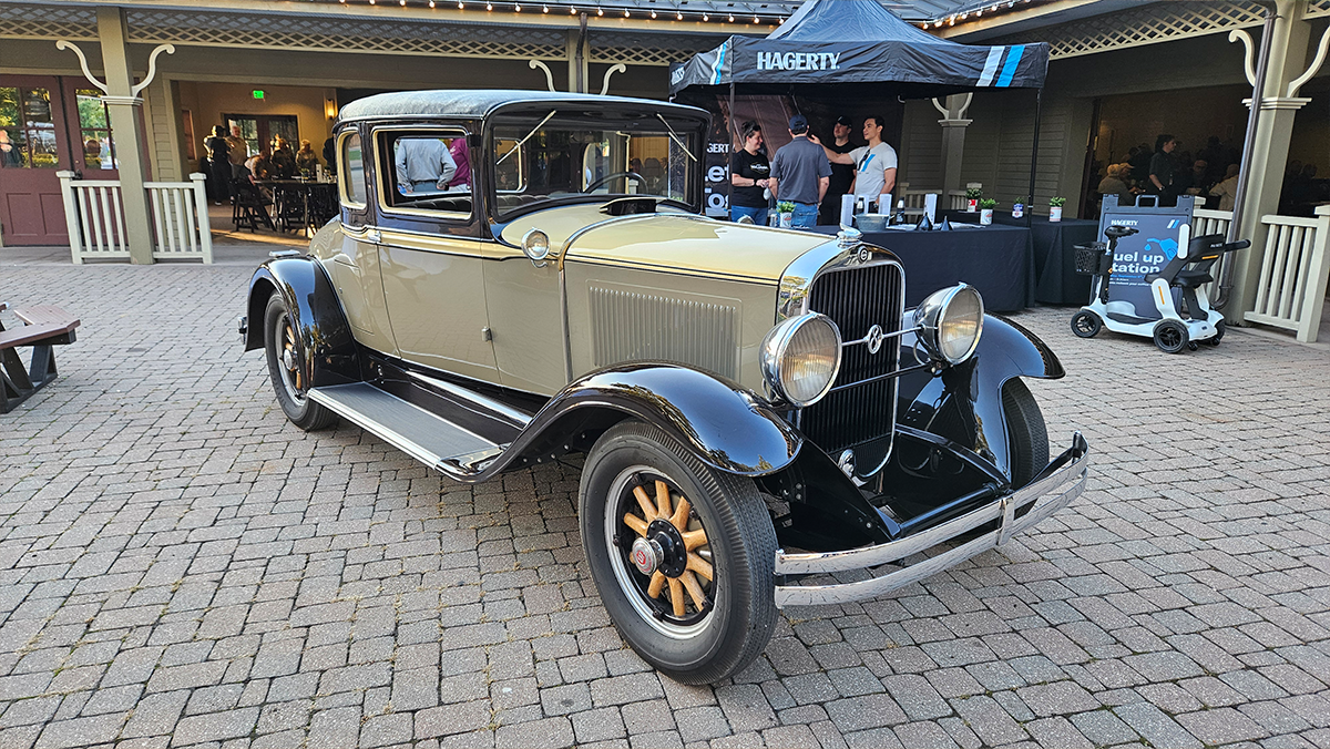 a green and beige 1930 Studebaker Victoria coupe