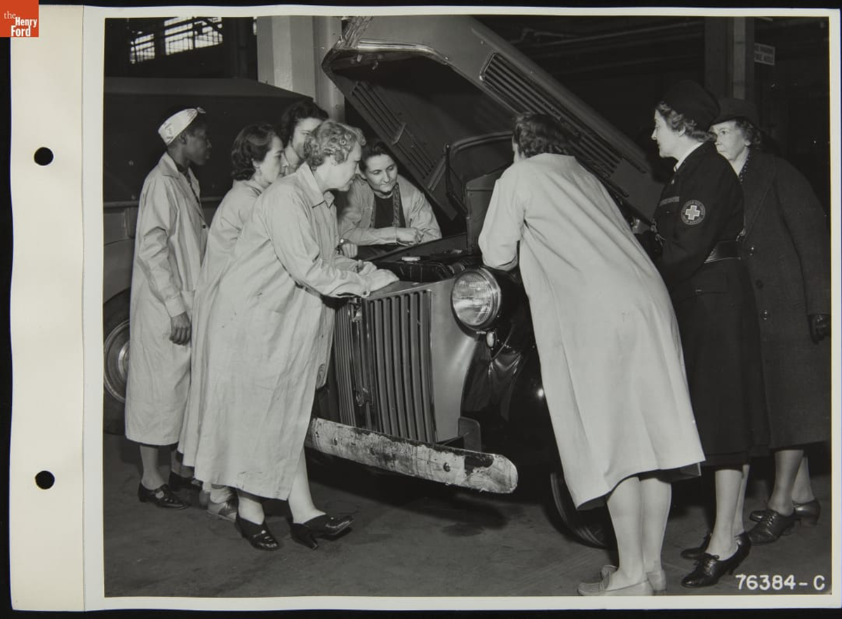 American Red Cross Women's Motor Corps members becoming familiar with engines during an auto maintenance class
