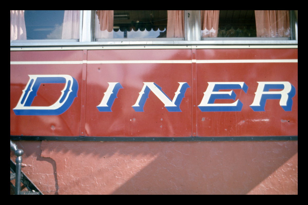 Lettering on a porcelain enamel diner façade, Peerless Diner, later Four Sons Diner, Lowell, Massachusetts. Photograph by Dick Gutman.