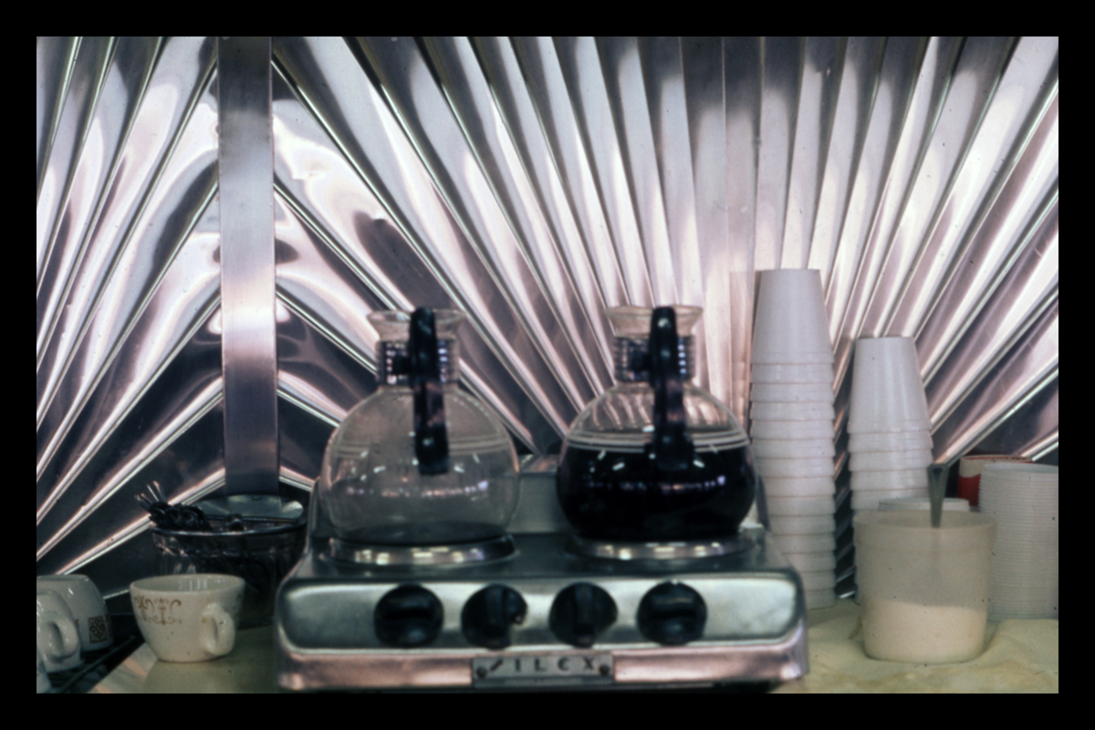 Coffee pots in front backbar clad in sunburst stainless steel panels, Phillips Diner, Woodbury, CT. Photograph by Dick Gutman.