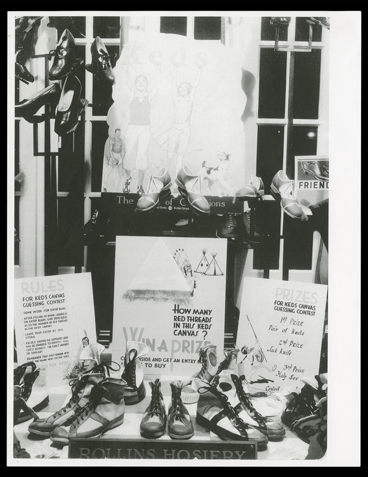 Keds window display at the Campbell Boot Shop, Charlevoix, Michigan, circa 1930. This shoe store used window display contests to attract young customers with the possibility of brand new shoes