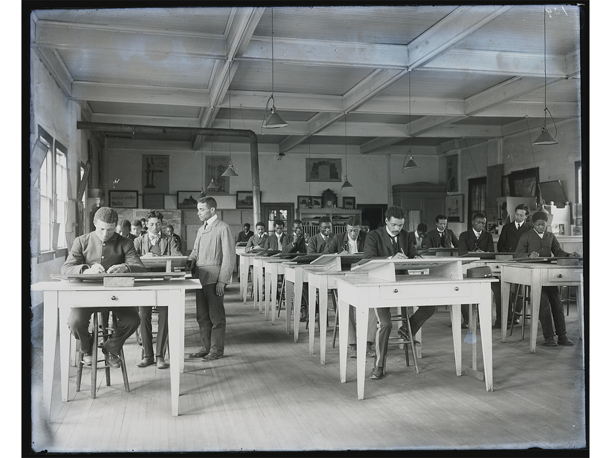 Wallace Augustus Rayfield and students in a mechanical drawing class at Tuskegee Institute, Tuskegee, Alabama, circa 1902.