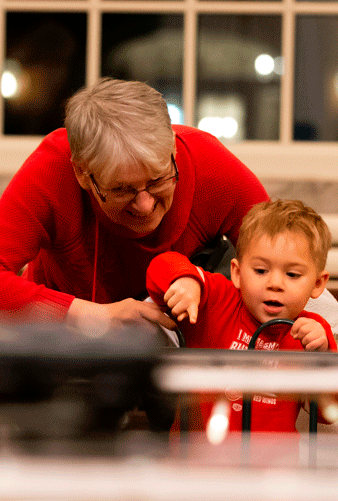 Member with child viewing train display